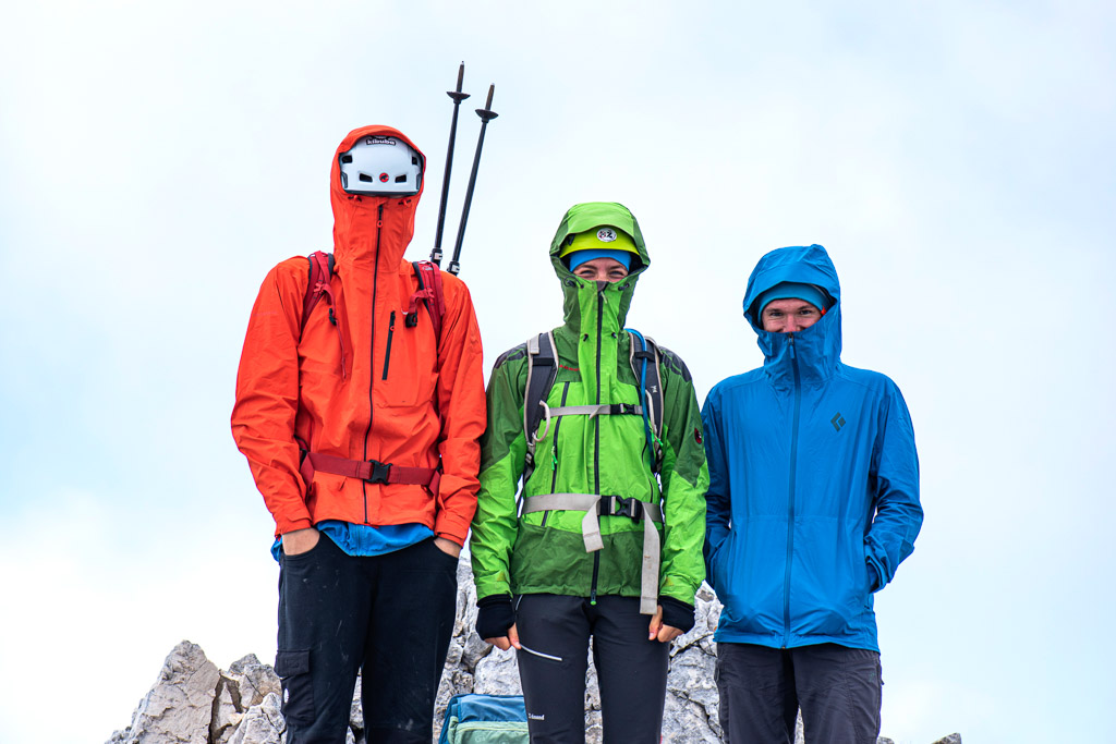 alpinist on mountain summit foggy day slovenia photography