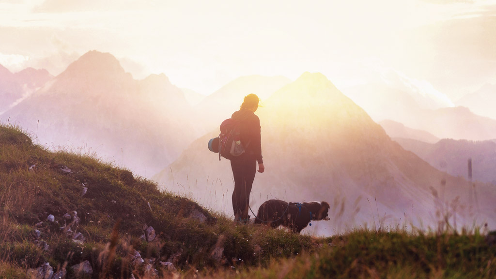sunset ridge hiking slovenia girl with dog