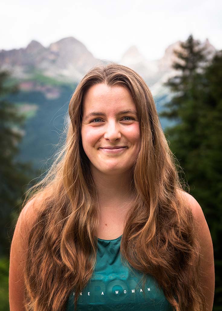 female portrait with mountains in the background